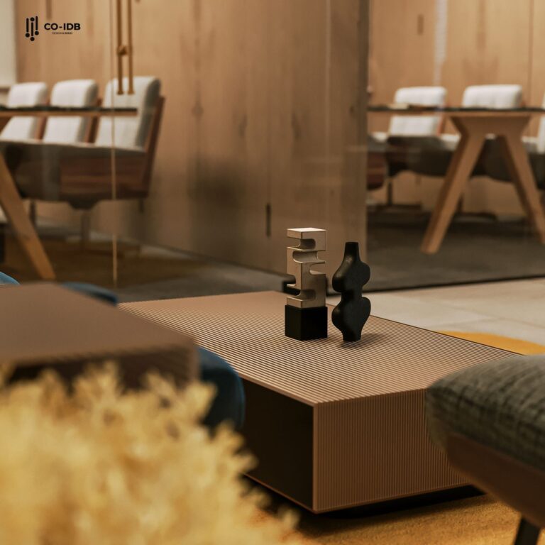 Cận cảnh một bàn trà hiện đại với các vật trang trí trừu tượng, trong một không gian nội thất sang trọng.