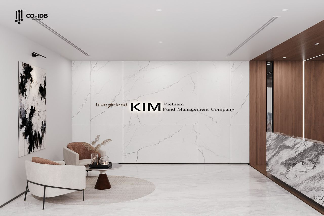 Sảnh tiếp đón với tường đá vân mây, ghế chờ hiện đại và điểm nhấn logo thương hiệu.