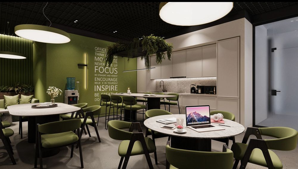 Khu pantry văn phòng hiện đại với gam xanh chủ đạo, kết hợp cây xanh và ánh sáng ấm, tạo không gian mang tính thư giãn