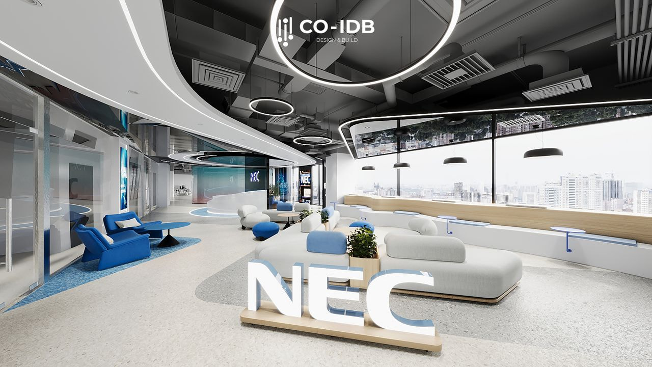 Khu vực chờ với ghế sofa màu xanh lam trong một phòng kính tròn ở văn phòng.