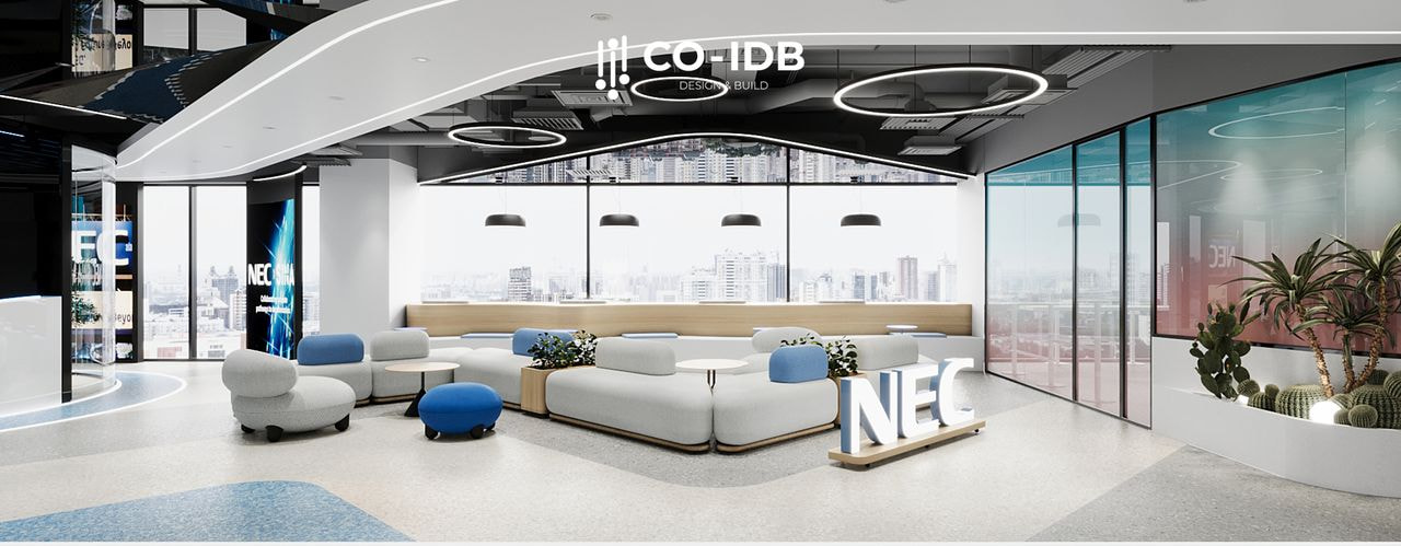 Khu vực tiếp khách và thư giãn với ghế sofa module màu xám và đèn trang trí trần.